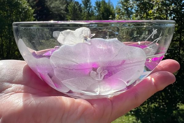 Flowers in a bowl in a hand
