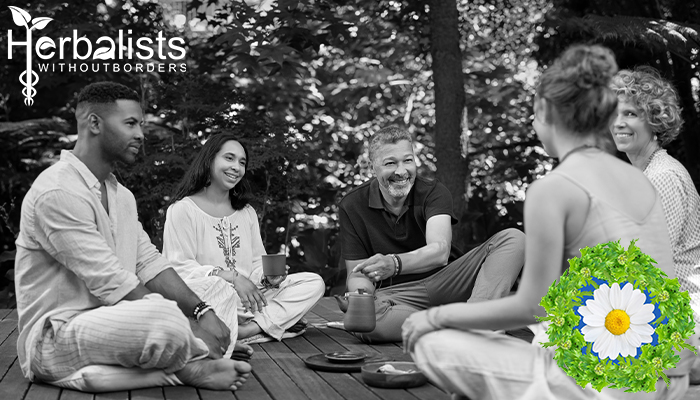people sitting in a circle sharing a cup of tea