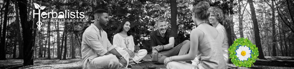 people sitting in a circle sharing a cup of tea 